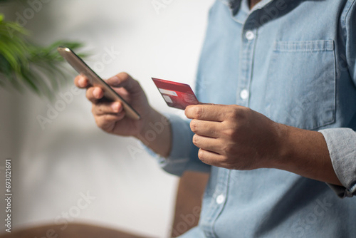 Businessman uses credit card to shop online  pay