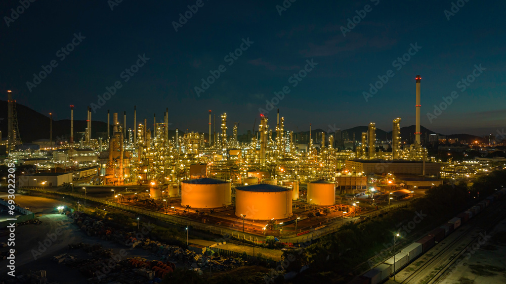 Aerial view of the morning of the oil refinery from the drone of the tower of the Petrochemistry industry in the oil and gas industry with cloud sun orange Aerial view of the morning of the oil refinery from the drone of the tower of the Petrochemistry industry in the oil and gas industry with cloud sun orange