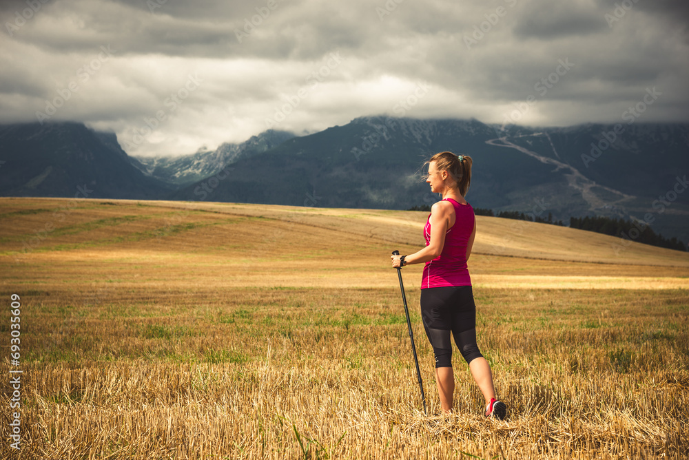 Young woman hiking in the mountains Young woman hiking in the mountains