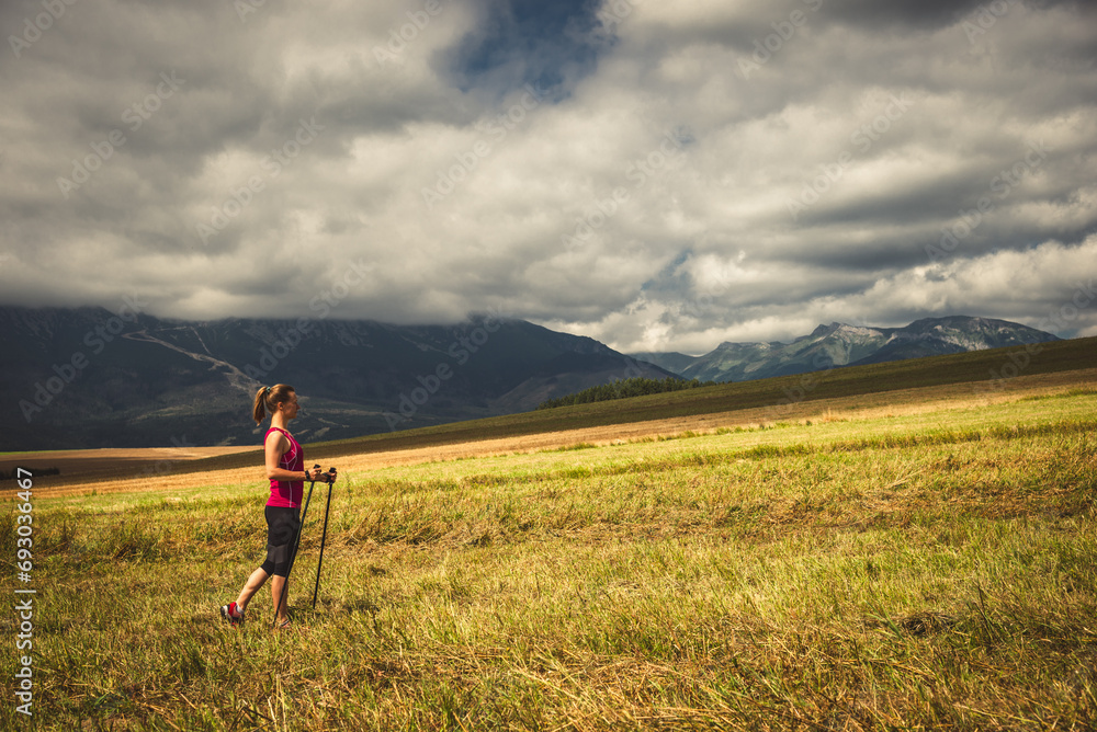 Young woman hiking in the mountains