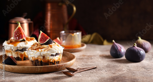 dessert parfait in a glass with cream and fresh figs