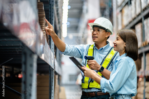 Warehouse staff working together using digital tablets to check the stock inventory on shelves in large warehouses, smart warehouse management system, supply chain, logistic network technology concept photo
