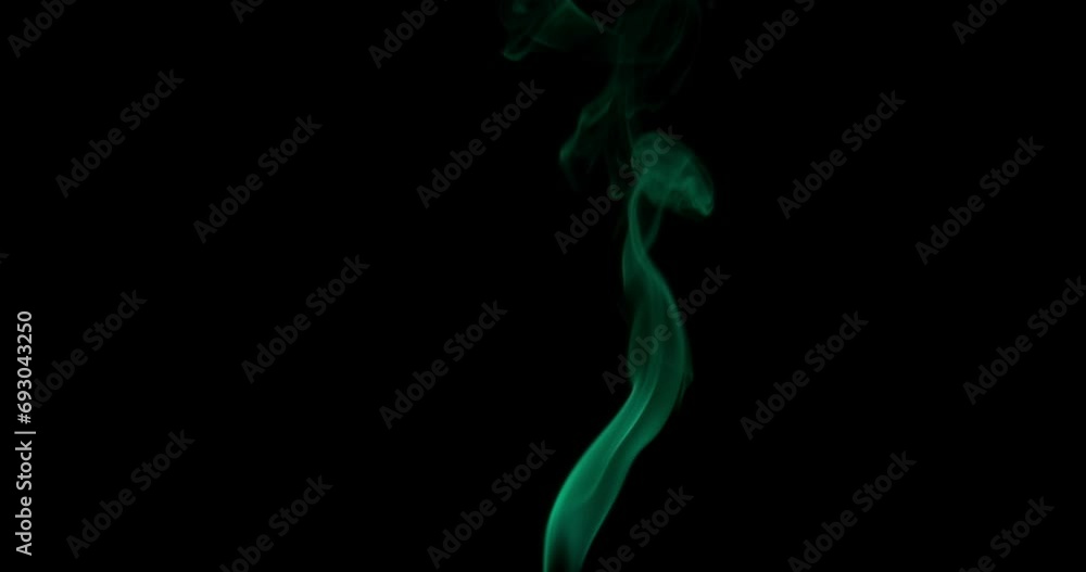 Natural smoke with green emerald backlight on a black background Natural smoke with green emerald backlight on a black background