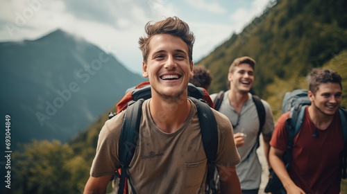 Young cheerful smiling clean shaven male men hiking in summer mountains
