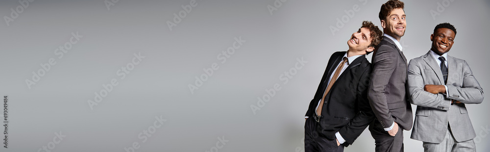 jolly diverse friends in business casual outfits posing on gray backdrop and smiling happily, banner jolly diverse friends in business casual outfits posing on gray backdrop and smiling happily, banner