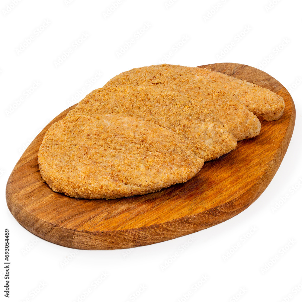 Raw beef cutlets on a wooden board on a white background, isolated Raw beef cutlets on a wooden board on a white background, isolated