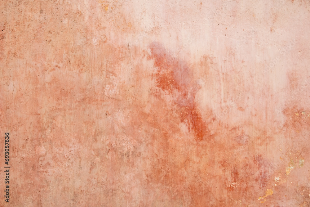 Texture of old rustic wall covered with pink stucco. Abstract background for design.