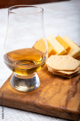 Scotch whiskey and cheese pairing, British cheeses collection, Scottish coloured and English matured cheddar cheeses © barmalini