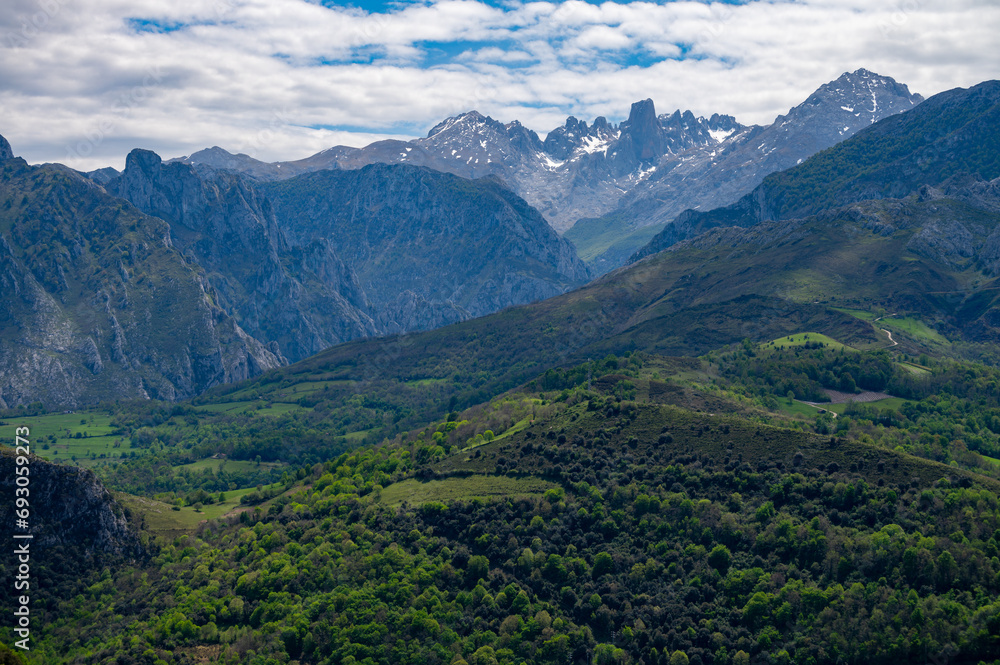 Fototapeta premium Panoramic view on Naranjo de Bulnes or Picu Urriellu, limestone peak dating from Paleozoic Era, located in Macizo Central region of Picos de Europa, mountain range in Asturias, North Spain