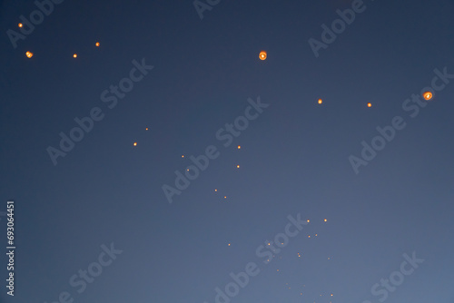 Thai people release sky floating lanterns or lamp to worship Buddha's relics at night. Traditional festival in Chiang mai, Thailand. Loy krathong