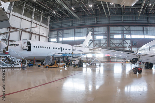 White passenger aircrafts in the aviation hangar
