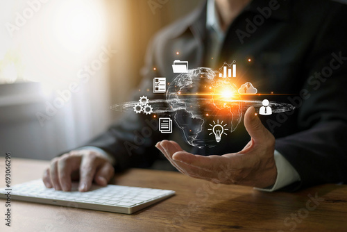 Businessman hand showing transformation of ideas and the adoption of technology in business in the digital age, enhancing global business capabilities Ai, IoT, internet of things. 