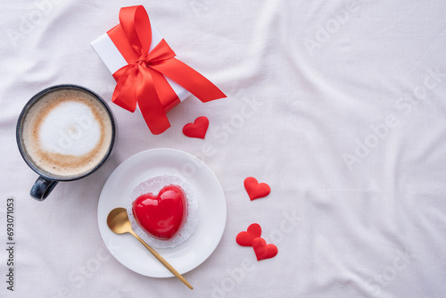 heart shaped glazed valentine cake in bed