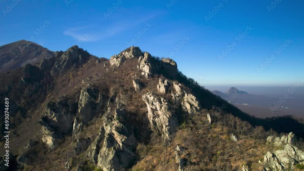 Beautiful aerial view of a mountain range with high cliffs. Landscape and nature of the North Caucasus Beautiful aerial view of a mountain range with high cliffs. Landscape and nature of the North Caucasus