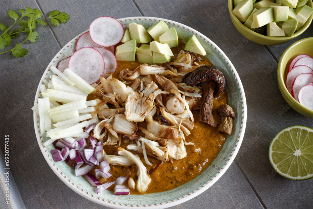 Vegan Pozole topped with fresh vegetable ingredients. Mexican cuisine homemade food with jackfruit instead of meat... Vegan Pozole topped with fresh vegetable ingredients. Mexican cuisine homemade food with jackfruit instead of meat...