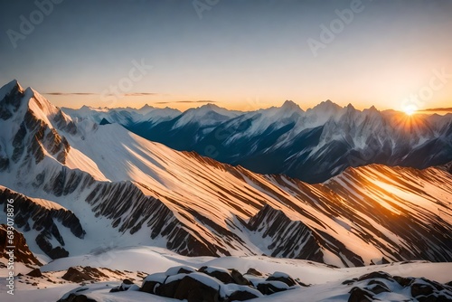 A peaceful mountain range with the first rays of the sunrise casting a golden glow on snow-capped peaks