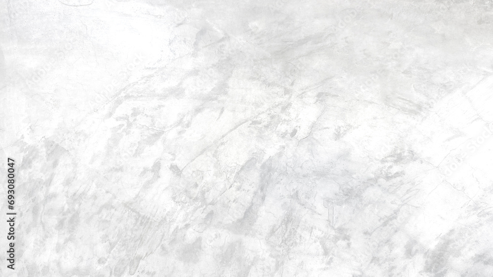 The light-colored cement wall has cracks. The light-colored cement wall has cracks.