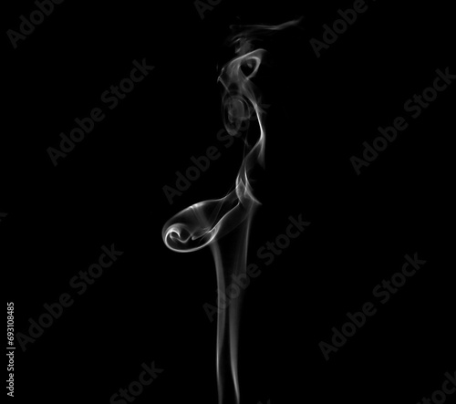 White smoke or steam smog moves on a black background. Beautiful gray smoke 

