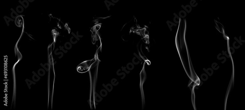 White smoke or steam smog moves on a black background. Beautiful gray smoke 