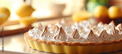 Homemade lemon meringue pie and desserts in kitchen with blurred background and text space