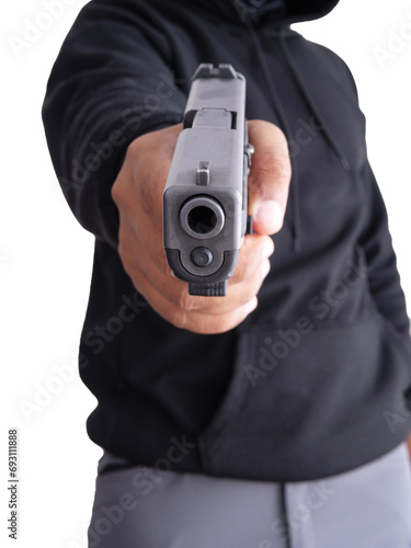 Unidentified male criminal wearing a black hoodie and covering his face, holding a pistol and aiming. On a white background with cliping path. thief.weapon, crime.burglar,cat paw,burglar © Tanawit