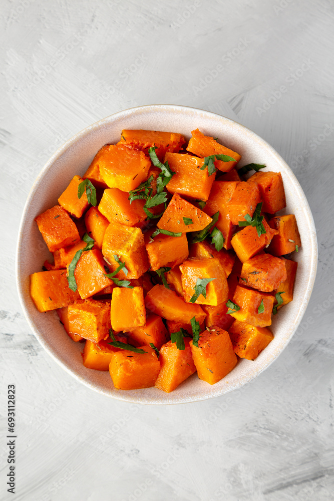Home-baked Butternut Squash with Herbs and Spices, top view. Flat lay, overhead, from above. Home-baked Butternut Squash with Herbs and Spices, top view. Flat lay, overhead, from above.