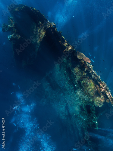 Diving at wreck in Tulamben  Bali. Freediving in deep sea on best diving spot