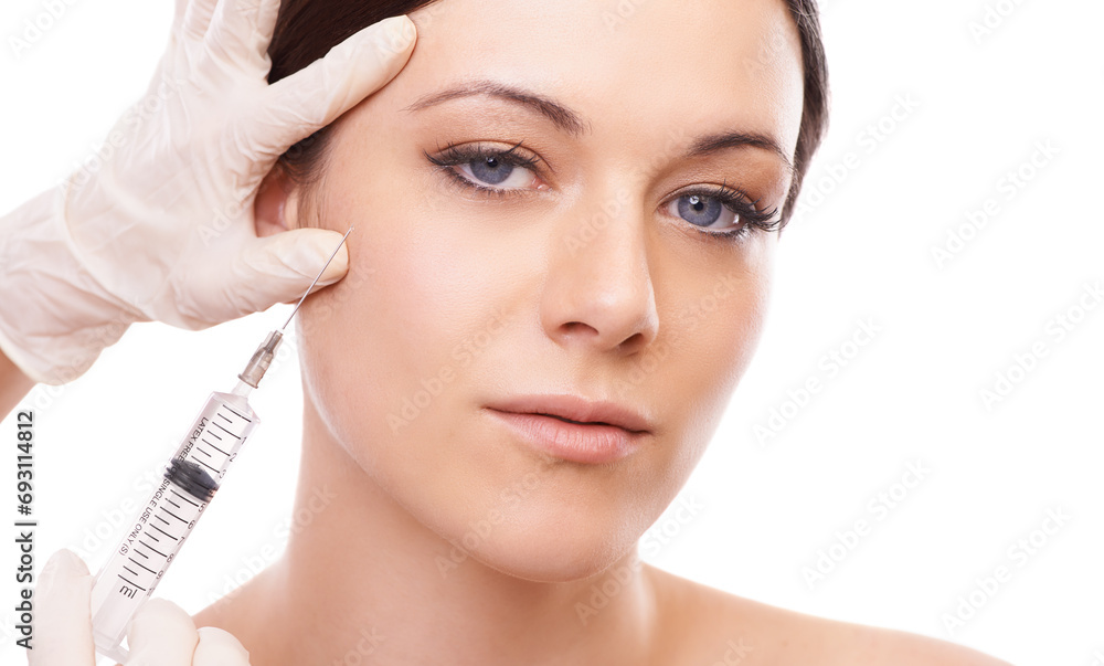 Woman, portrait and needle for plastic surgery in studio for injection, chemical and product by white background. Girl patient, surgeon and syringe for change, transformation and results with beauty