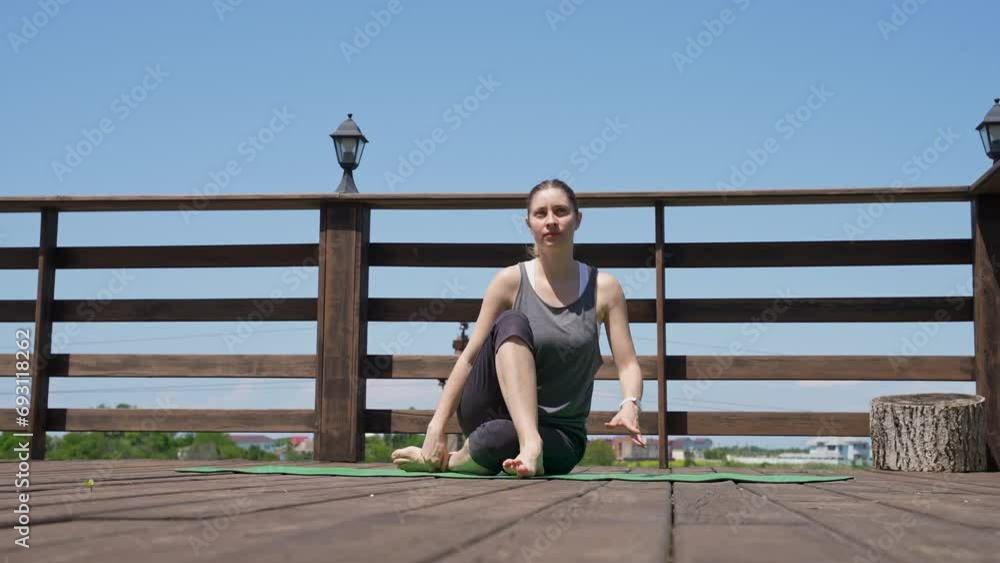 Healthy mature girl practicing yoga outdoor. Attractive woman doing yoga exercise on backyard breathing deeply in and out in park, enjoying stretching Healthy mature girl practicing yoga outdoor. Attractive woman doing yoga exercise on backyard breathing deeply in and out in park, enjoying stretching