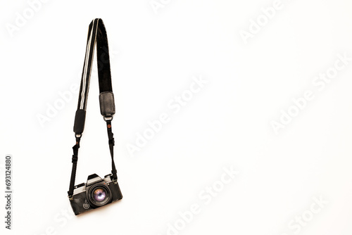 Camera hanging on isolated white background photo