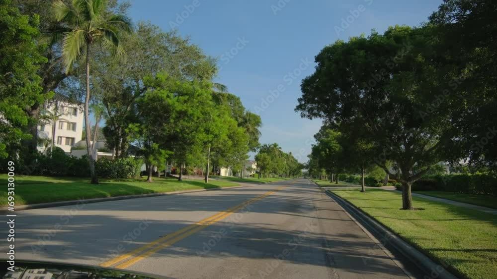 Wde view POV car driving on street in Naples Florida. road with cars in traffic Wde view POV car driving on street in Naples Florida. road with cars in traffic