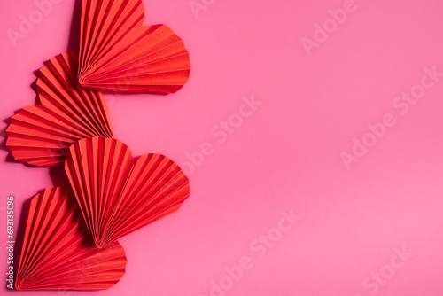 Beautiful hearts on a pink background, symbol of love, happy woman, mother, Valentine's Day, greeting card design. photo
