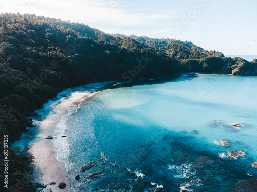 Drone photo above Ohope beach in New Zealand showing beaches, different rock formations, flora and fauna. photo