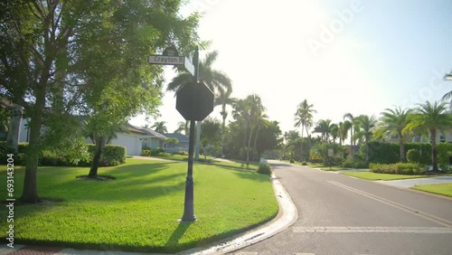 Side wide view POV car driving on street in Naples Florida. road with cars in traffic  photo