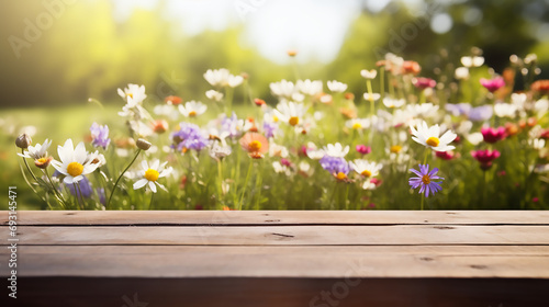 Empty old wooden table with defocused beautiful meadow full of spring flowers background, Template, Mock up  © KJ Photo studio