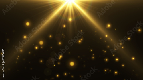 Particles and gold light on black background.