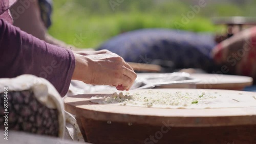Turkish elderly woman making falafel flat bread. Traditional turkish cuisine
 photo