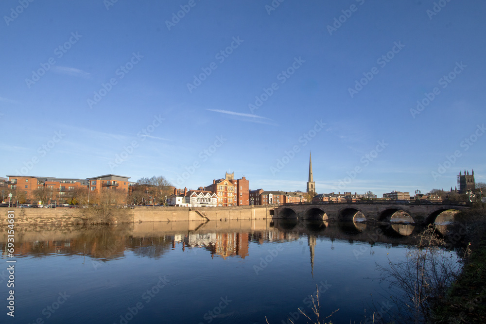 A calm autumn morning looking across the River Severn in Worcester, Worcestershire, UK