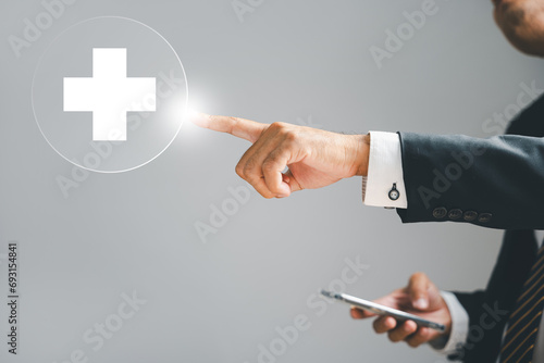 A businessman hand touches a virtual plus sign, representing positivity. Conveys ideas of added benefits, progressive thinking, and a positive mindset in business. positive thing