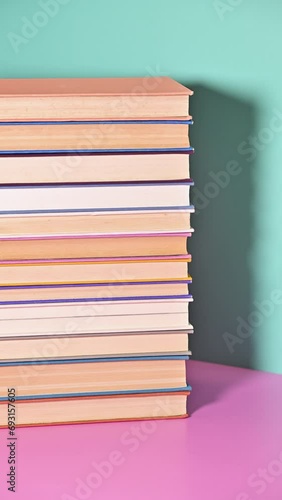 Wallpaper Mural Vertical Stop Motion of Ordering a Pile of Books Torontodigital.ca