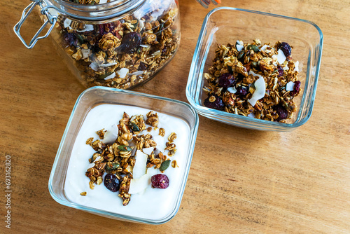 Granola with milk and fresh berries in a white bowl