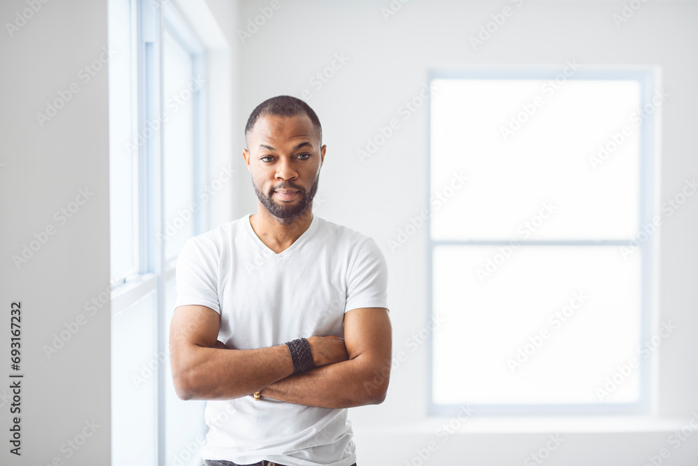 portrait of a man on white appartement with white shirt portrait of a man on white appartement with white shirt
