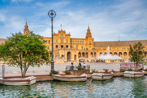 Sevilla, Spain - April 10, 2023: Tourists enjoy outdoor time in Plaza de Espana at sunset