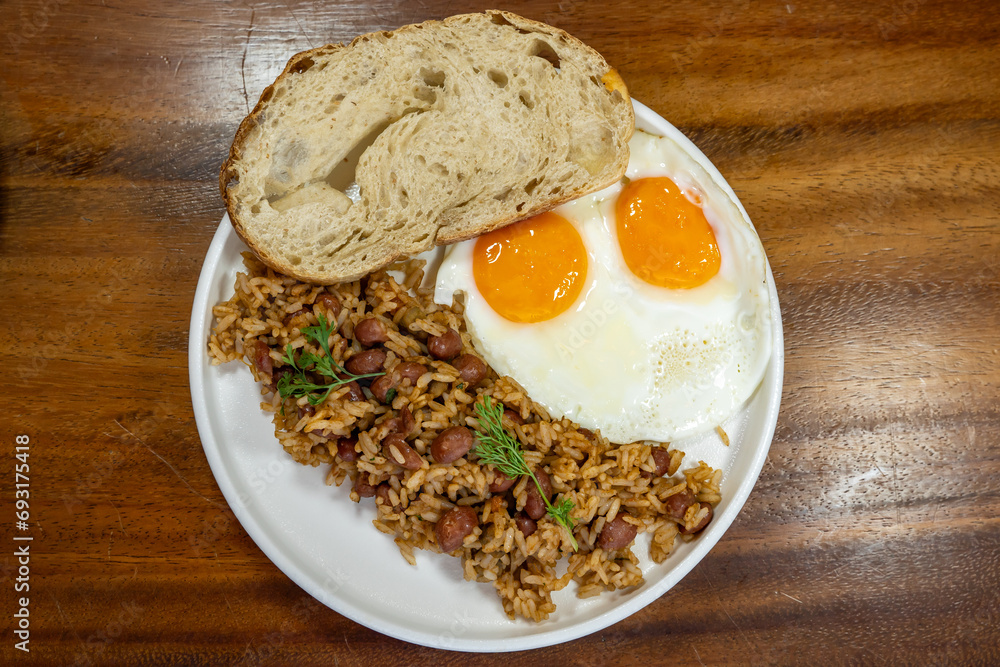 Colombian breakfast with bread, eggs and warmed rice Colombian breakfast with bread, eggs and warmed rice