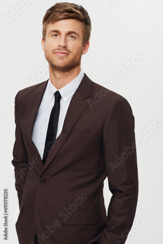 Portrait, business and a confident young man in studio on a white background for a corporate career or job opportunity. Company, work and a professional person in a suit as an employee or salesman