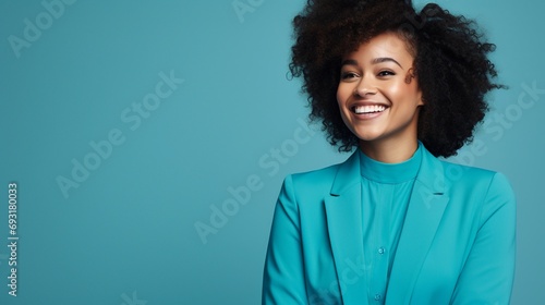 happy black woman with blue shirt and a blue background