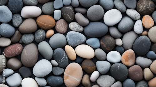  a close up of a pile of rocks with different colors and sizes of rocks on top of each of the rocks is black, white, red, orange, and gray.