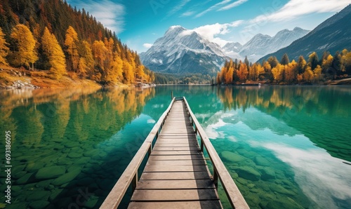 Mountain Majesty: Saturated Turquoise Lake in Fall with Reflections and Wooden Pier  © hisilly
