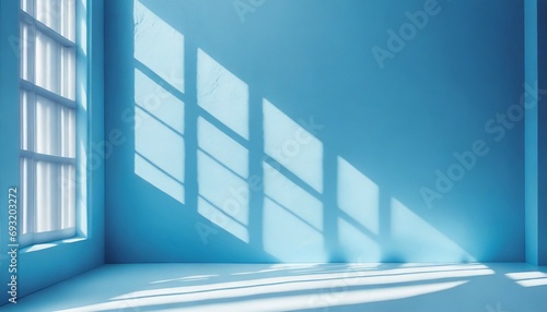 minimal abstract light blue background for product presentation shadow and light from windows on wall