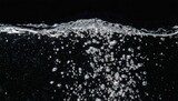 soda water bubbles splashing underwater against black background cola liquid texture that fizzing and floating up to surface like a explosion in under water for refreshing carbonate drink concept
